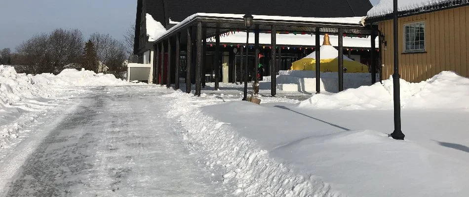 Thick snow along the walkway of a commercial property in Louisville, KY.