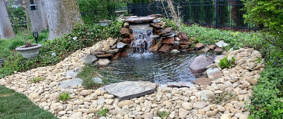 Water feature in Louisville, KY, with rocks and plants.