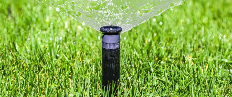 Irrigation system spraying water on a lawn in Lyndon, KY.
