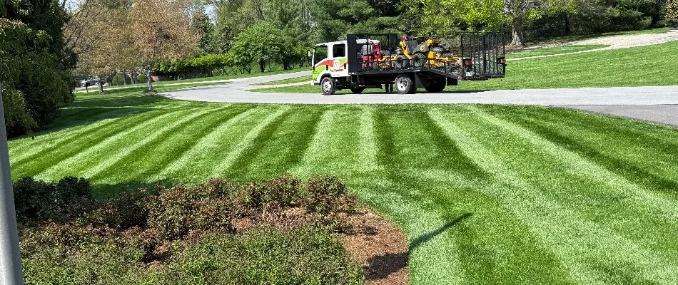 Newly mowed lawn in Seneca Gardens, KY, with a nearby truck.