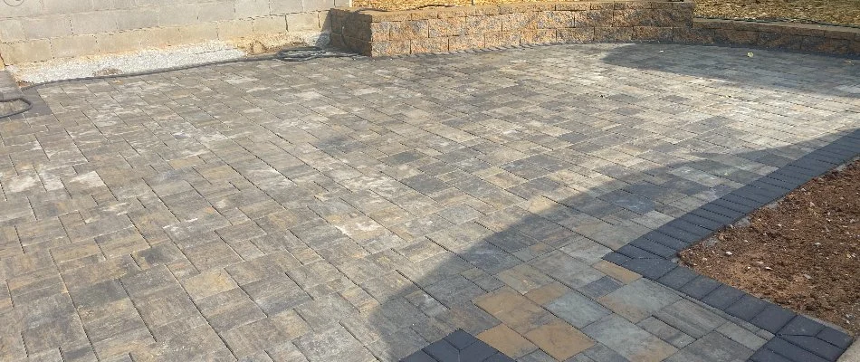 Paver patio with a retaining wall in West Buechel, KY.