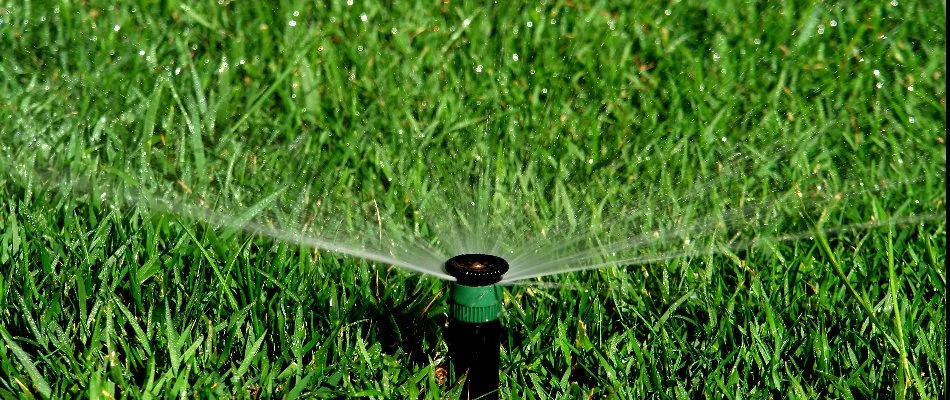 Sprinkler irrigation system in Indian Hills, KY, spraying a lawn. 