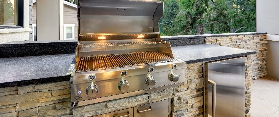 Stainless steel grill and a countertop in an outdoor kitchen in Louisville, KY.