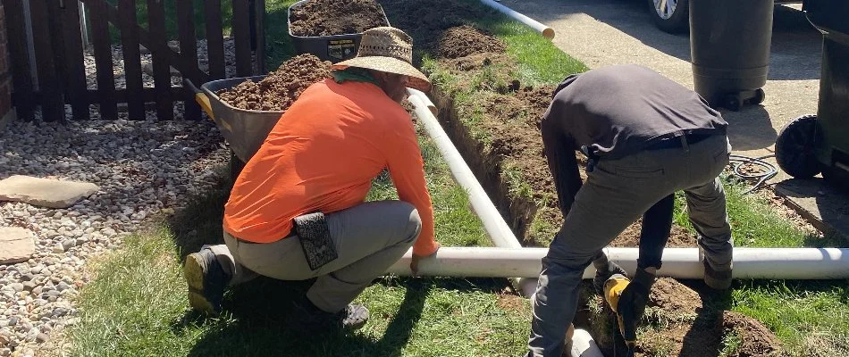 Workers installing a French drain in Louisville, KY.